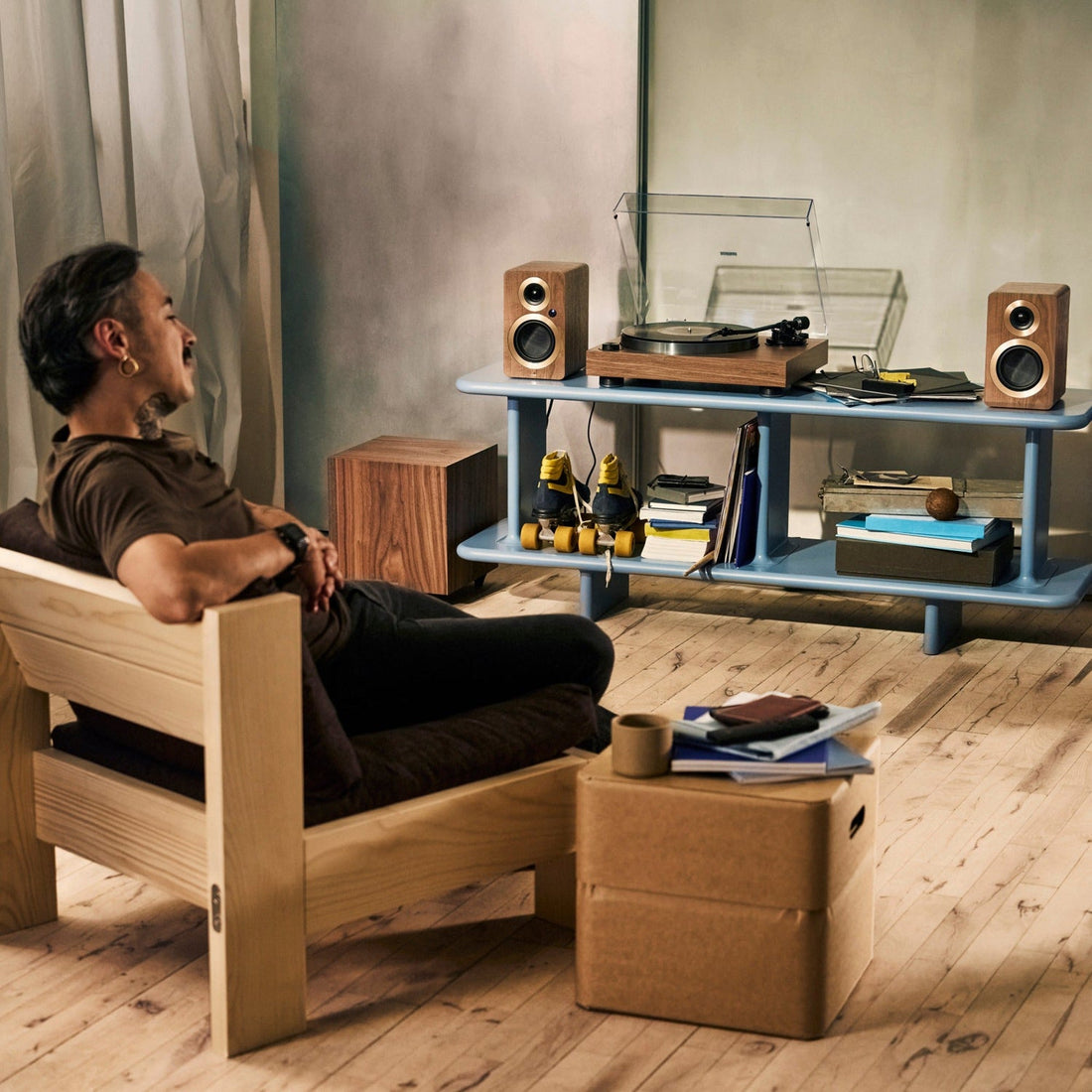 Argon Audio AURORA turntable in walnut in a living room with Argon speakers