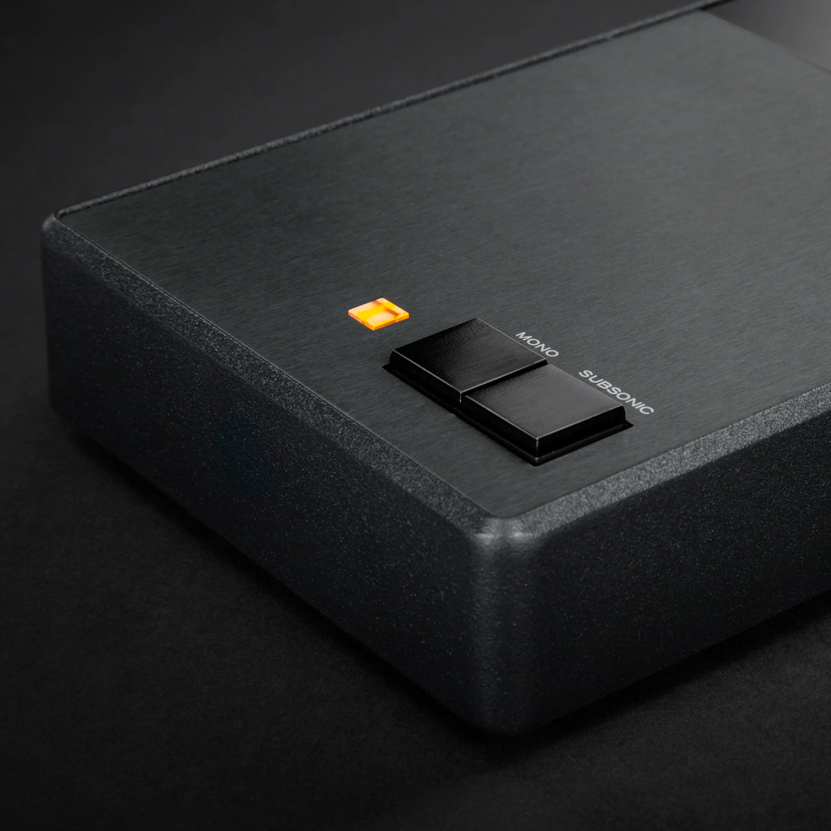 Close-up of MoFi Electronics StudioPhono phono preamp showing input and control knobs on a sleek black device.