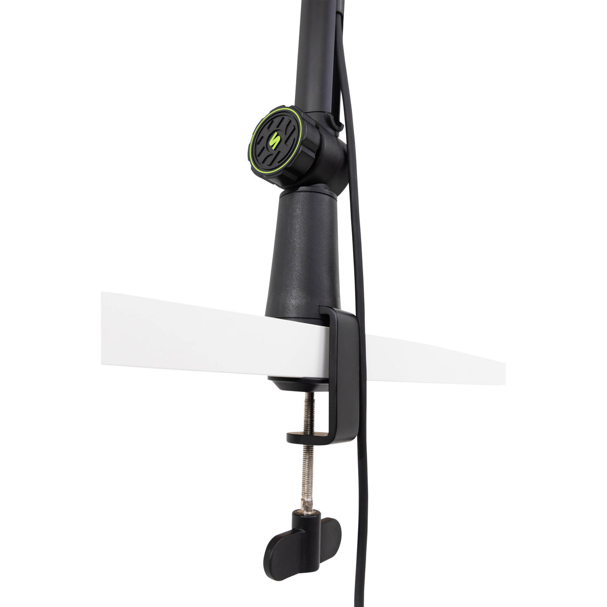Shure SH-BROADCAST1 broadcast microphone arm mounted on a desk, adjustable metal arm for professional audio setup.