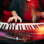 Musician playing the Arturia MiniFreak 49 full-size semi-weighted keyboard