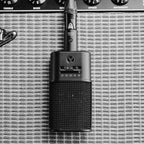 Austrian Audio OC616 in front of a guitar amplifier