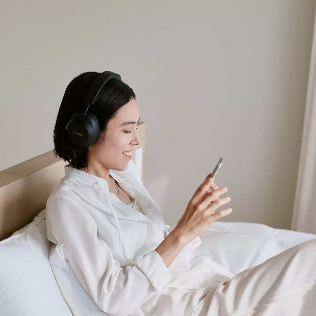Technics EAH-A1000 in Black worn while relaxing in bed
