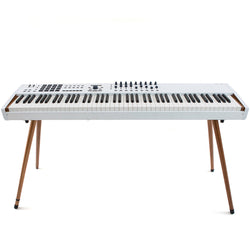 Arturia wooden legs for Keylab 88 MK2 and Polybrute, showcasing rich wood grain and sturdy design for keyboard support.